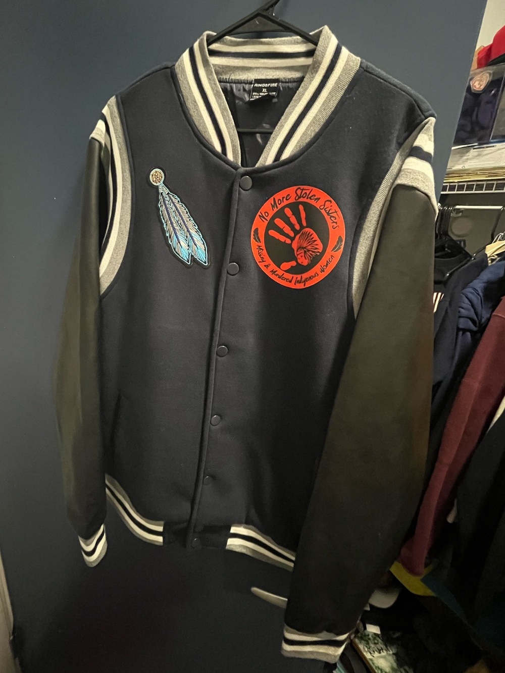 No More Stolen Sisters and Native American Feather Varsity Jacket.